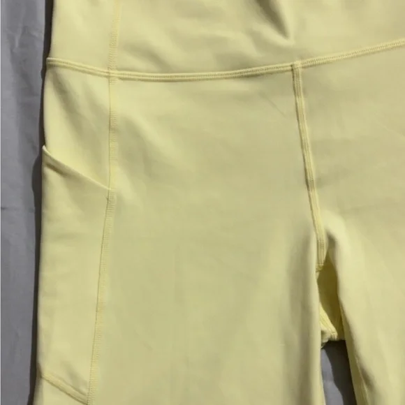 Fabletics Pure Luxe High Waisted Pastel Yellow Bike Shorts 6” - Picture 5 of 6